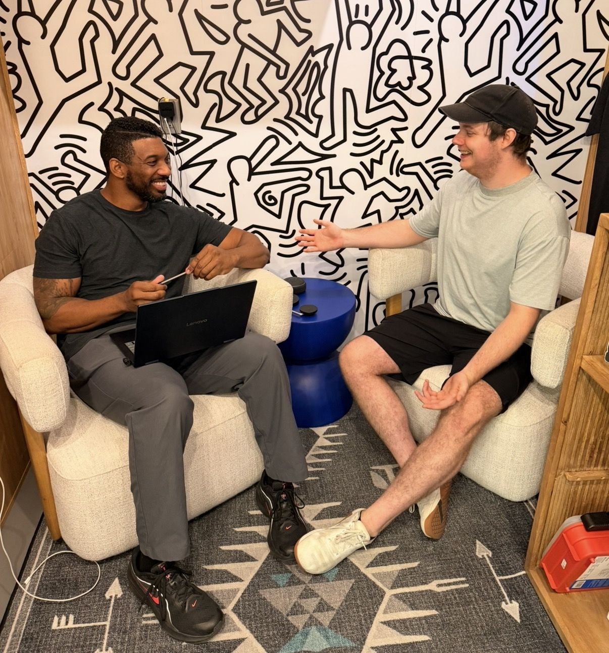 A Studio 617 trainer and a new client talking through goals in the studio lounge